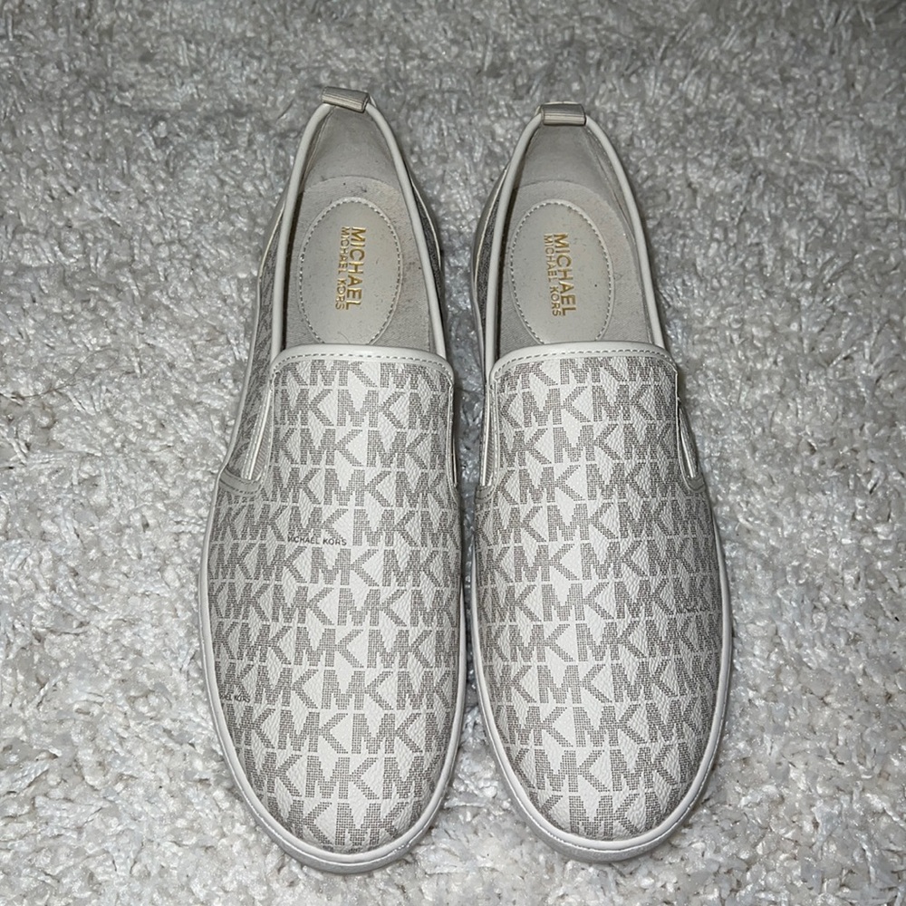 Michael Kors white logo slip on sneakers. New never worn